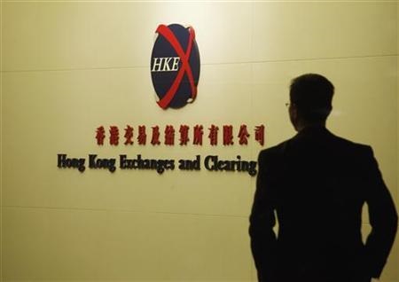 A man walks past the entrance to the Hong Kong Stock Exchange